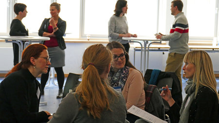People sitting together and discuss.